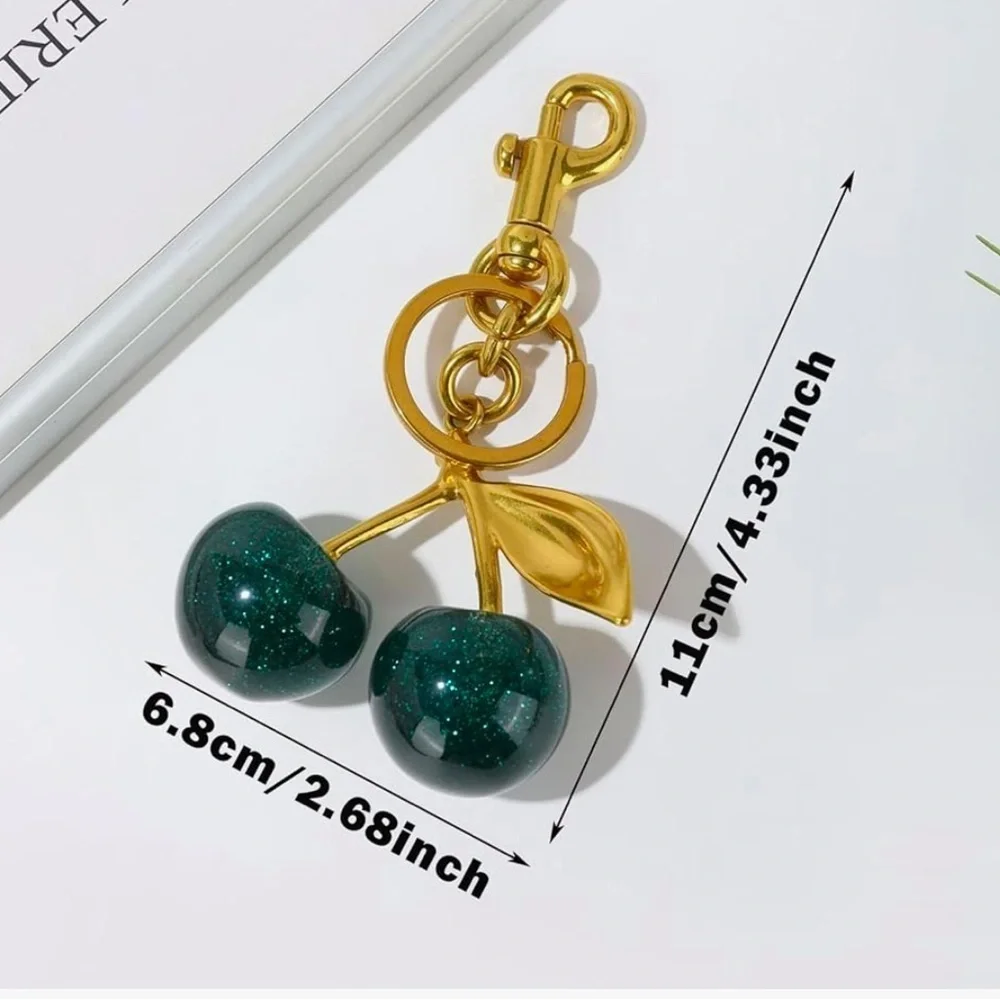Cherry bag charm in hunter green with sparkles and gold hardware